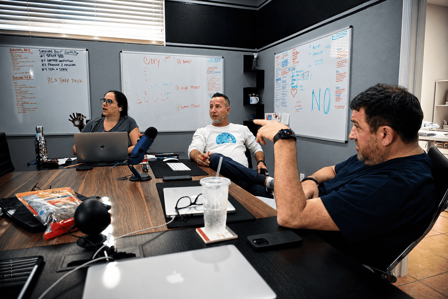 internet marketing mentor working through strategy at conference table